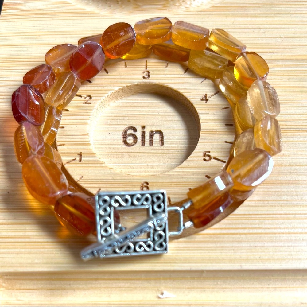 Citrine Double Strand bracelet with carved silver clasp. Measures 8”laying flat